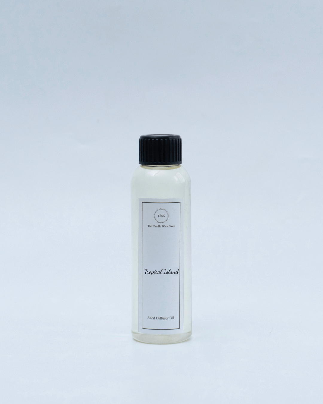 Tropical Island reed diffuser refill bottle for an uplifting fruity scent experience in home decor.