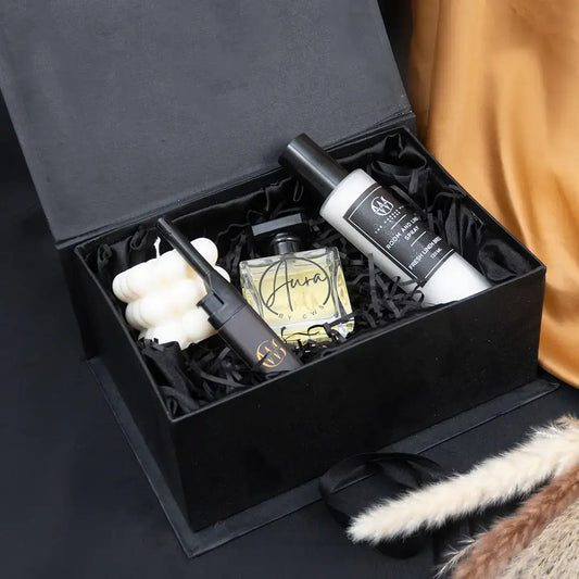 The Classic Gentleman Box featuring bold perfume, linen spray, and travel-size grooming essentials in a luxurious black packaging.
