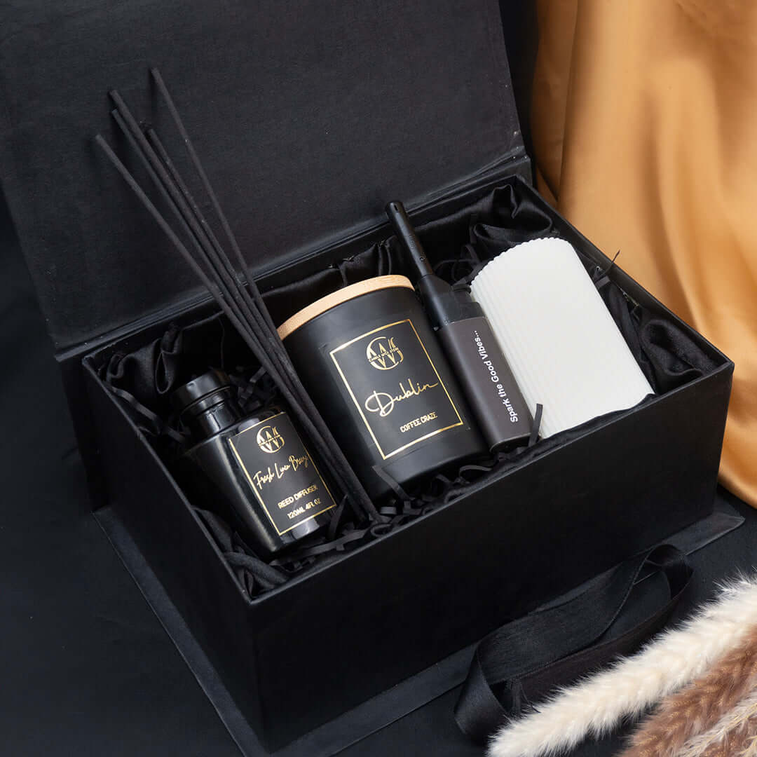 The Urban Refresh Box featuring a reed diffuser and candle for a serene home ambiance.