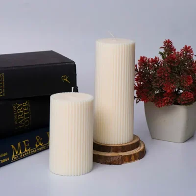 Pillar candle in white color inspired by the tall elevated design